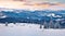 Frosty winter sunrise in Carpathian mountains with snow covered fir trees. Fantastic outdoor panorama, Happy New Year celebration