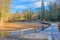 The frosty wooden curving walkway on an Autumn day