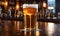 Frothy beer being poured into a chilled glass