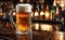 Frothy beer being poured into a chilled glass