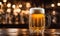 Frothy beer being poured into a chilled glass