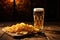 A frothy beer and crispy chips served in a cozy bar