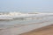 Frothy waves on beach