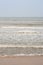 Frothy waves on beach