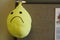 Frowning sad face smiley face yellow balloon deflated