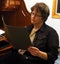 Frowning woman looking at papers in folder