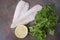 Frozen Alaska Pollock fillet with lemon and parsley.