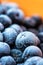 Frozen aronia chokeberry berries in a bowl