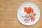 Frozen baby food homemade and raw food in white plate, Sliced carrot egg and rice for mashed on wooden board