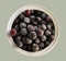 Frozen berries, black currants, in a porcelain dish. view from above. macro