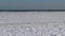 The frozen Black Sea, chunks and blocks of sea ice swaying on the water near the coast during a storm at sea near Odessa, Ukraine