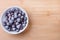 frozen blackcurrant on a wooden Board.