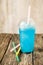 Frozen Blue Slushie in Plastic Cup with Straw