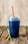 Frozen Blue Slushie in Plastic Cup with Straws