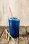Frozen Blue Slushie in Plastic Cup with Straws