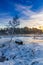 Frozen boat on the lake in winter