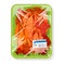 Frozen boiled red crayfishes are on green plastic tray covered with polyethylene food wrap.