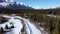 Frozen Bow River valley forest in winter. Snow capped Canadian Rockies