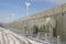 Frozen breakwater and bus stop after winter storm