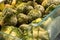 frozen broccoli florets and brussel sprouts inside freezer fridge closeup