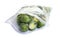 Frozen Brussels sprouts in plastic bag isolated. Vegetable preservation
