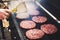 Frozen burger in the cook hand ready for preparing