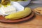 frozen butter with banana cookies and banana on a wooden cutting board.