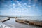 Frozen canal on Dutch winter farmland