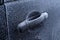 Frozen car door opener handle in winter, close-up