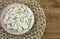 Frozen cauliflower in plate, wicker napkin