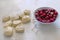 The frozen cherry, and dough with flour for preparation of pastries