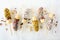 Frozen chocolate dipped banana pops, top view scattered on white marble