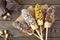 Frozen chocolate dipped banana pops, top view table scene over rustic wood