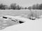 Frozen city lake with boat harbor