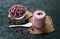 Frozen cranberry yogurt on a black background. The concept of healthy desserts.