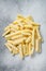 Frozen Crinkle French fries potatoes sticks. White background. Top view