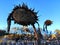 Frozen dried sunflower in sunflower field in warming first sunbeams of the day under cloudless deep blue sky