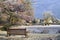 A frozen duck pond in an English village with a bench in the foreground. On a cold frosty winters day. Hanley Swan, Worcestershire