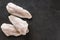 Frozen fillet white fish Pangasius on slate stone background. Seafood, top view, flat lay, copy space