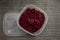 frozen food, frozen lingonberries. frozen lingonberries in a container. preservation of vitamins
