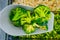 Frozen green broccoli on  spatula