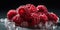 Frozen Group of Delicious Fresh Raspberries As Defocused Background