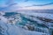 Frozen Gullfoss Falls in Iceland in winter at sunset.