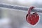 Frozen heart-shaped lock as a symbol