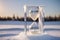 Frozen hourglass on the background of loose snow