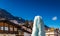 Frozen ice fountain in snowy alpine village