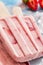 Frozen iced lolly with fresh strawberry ingredient