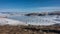 The frozen Lake Baikal is covered with lace-like snow