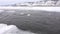 On the frozen Lake Baikal, there is a polynya in which ice floes float.