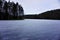 Frozen lake Haukkalampi on cloudy day in the Nuuksio Nationalpark